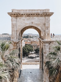 people walking on gray concrete arch during daytime