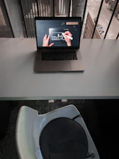 Illustration of a digital contract being signed remotely on a laptop.