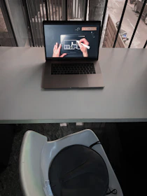 Illustration of a digital contract being signed remotely on a laptop.