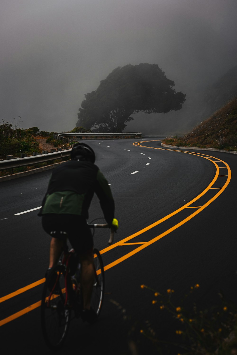 man riding bicycle on road during daytime