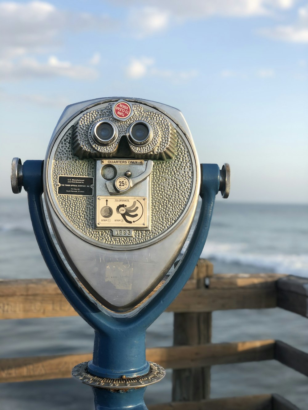 blue and gray coin operated binoculars