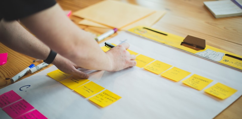 person writing on white paper