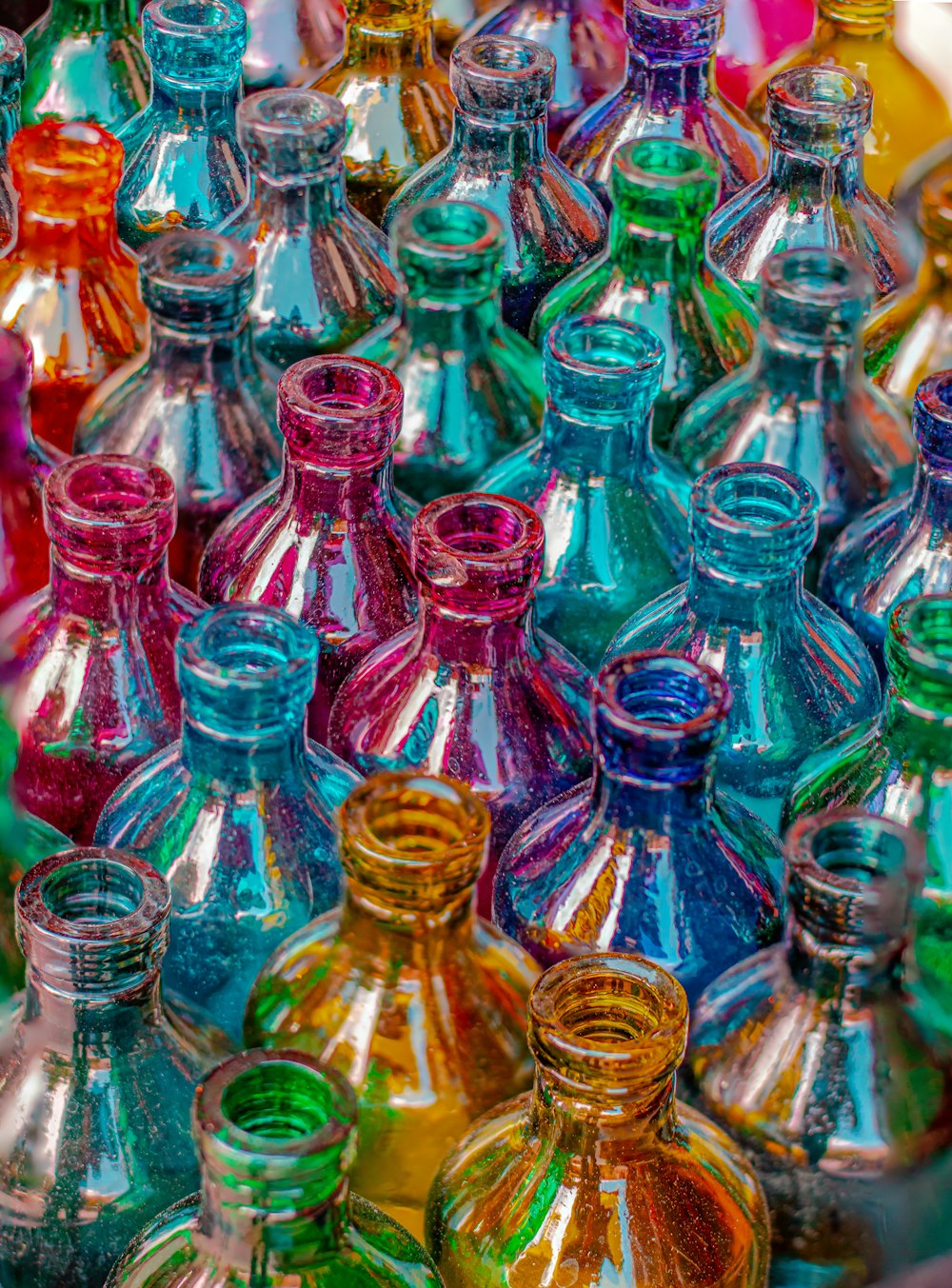clear glass bottles on brown wooden table