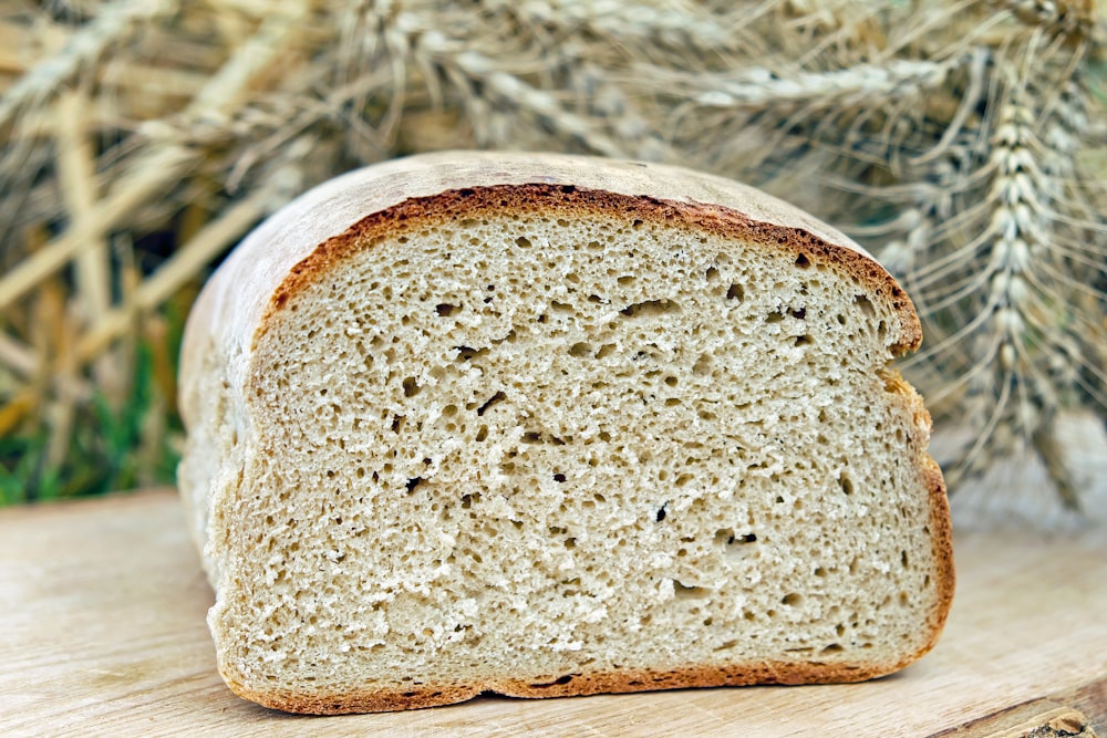 brown bread on white and brown textile