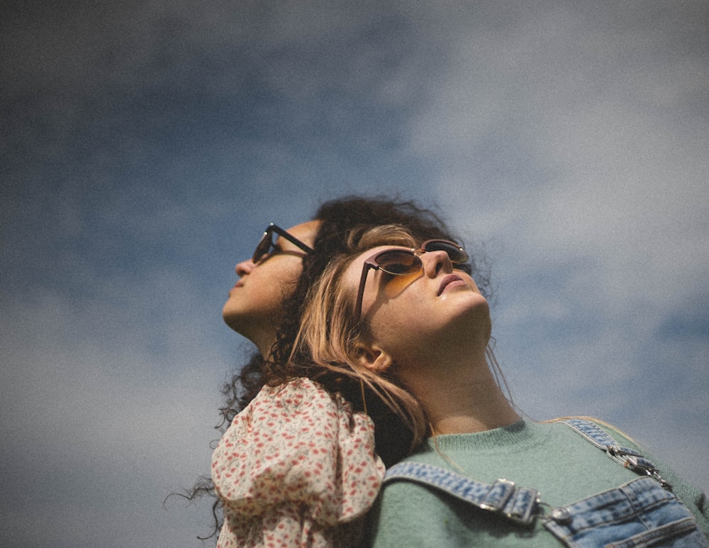 woman in black framed eyeglasses and blue denim jacket