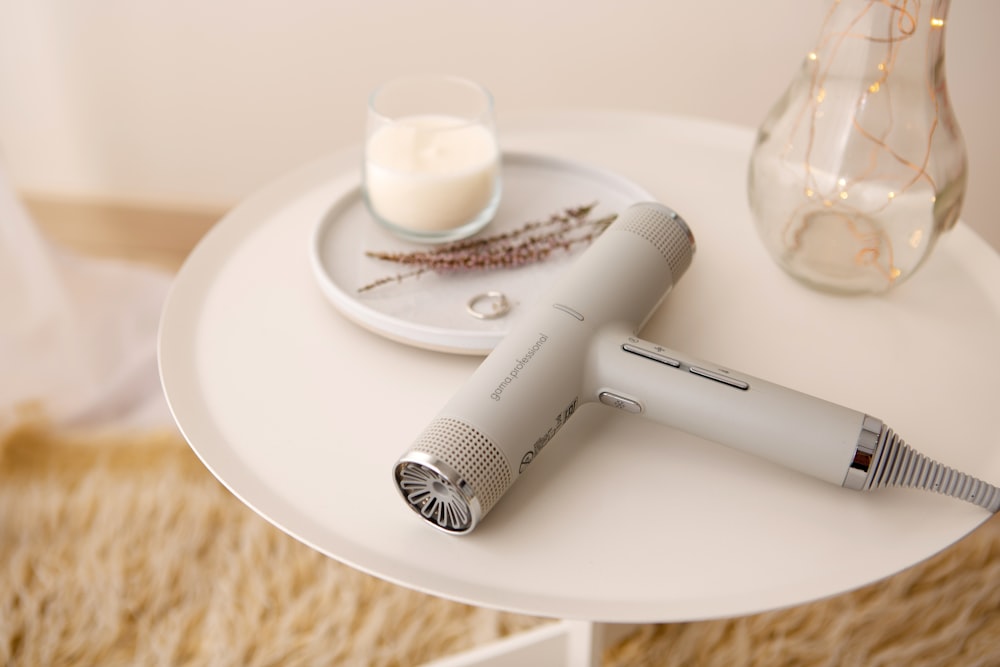 white and black hair brush on white round plate