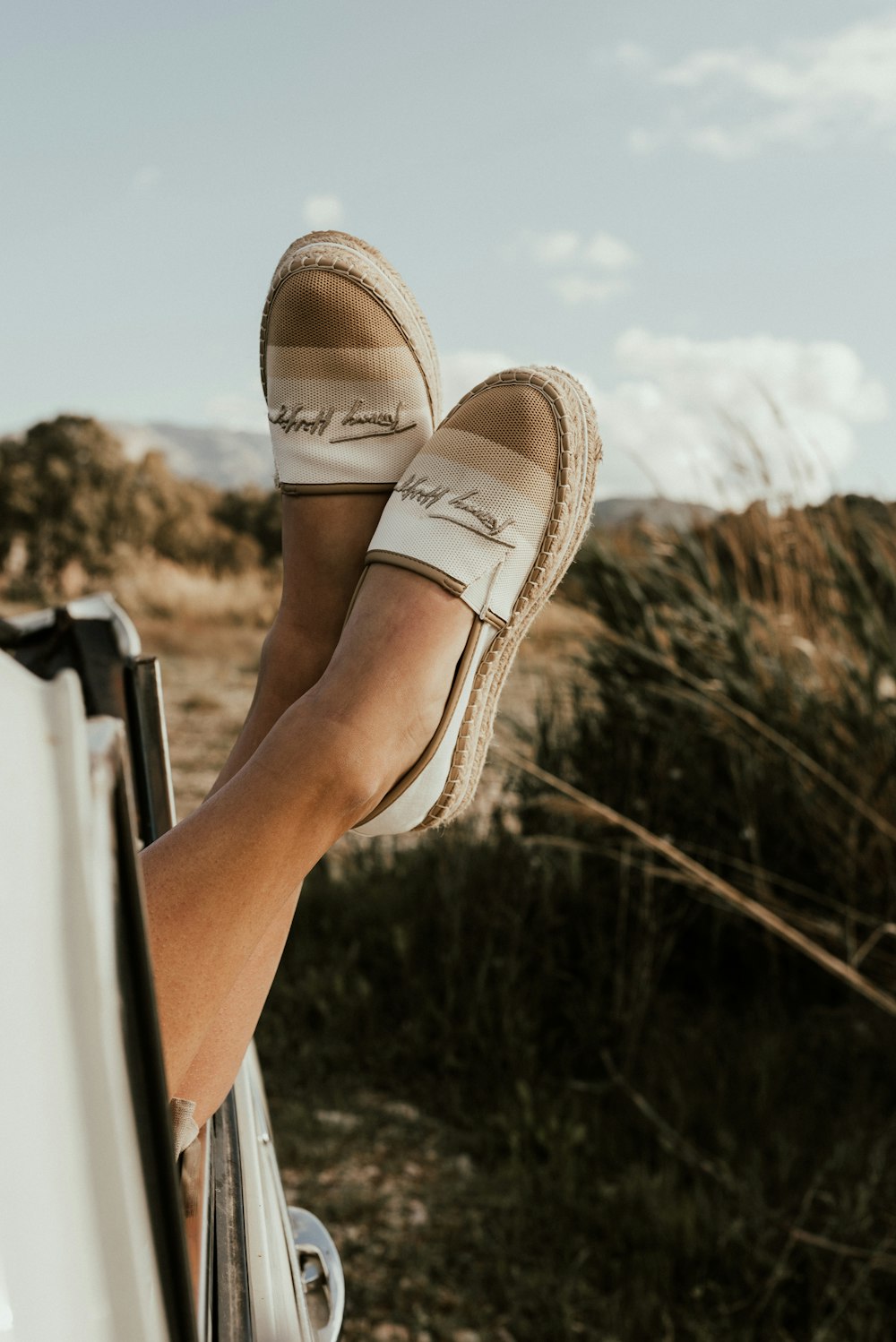 person wearing brown slip on shoes