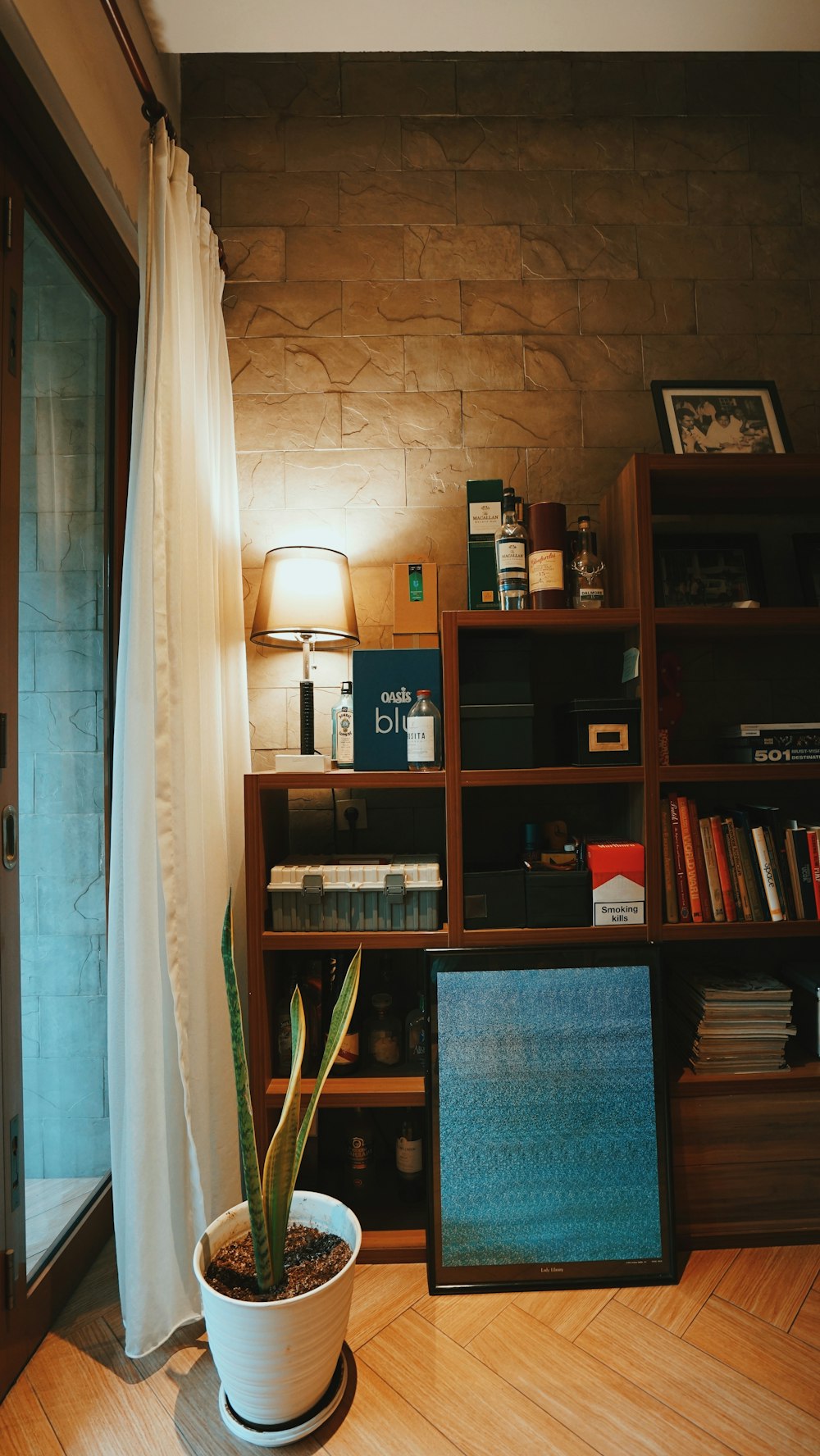 brown wooden shelf with books and books