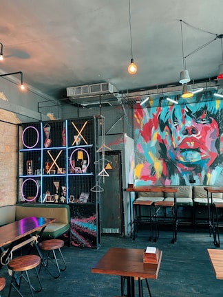 Creative wall graphics and branding elements displayed in a trendy café interior.