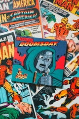 a pile of comic books sitting on top of a table