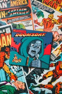 a pile of comic books sitting on top of a table