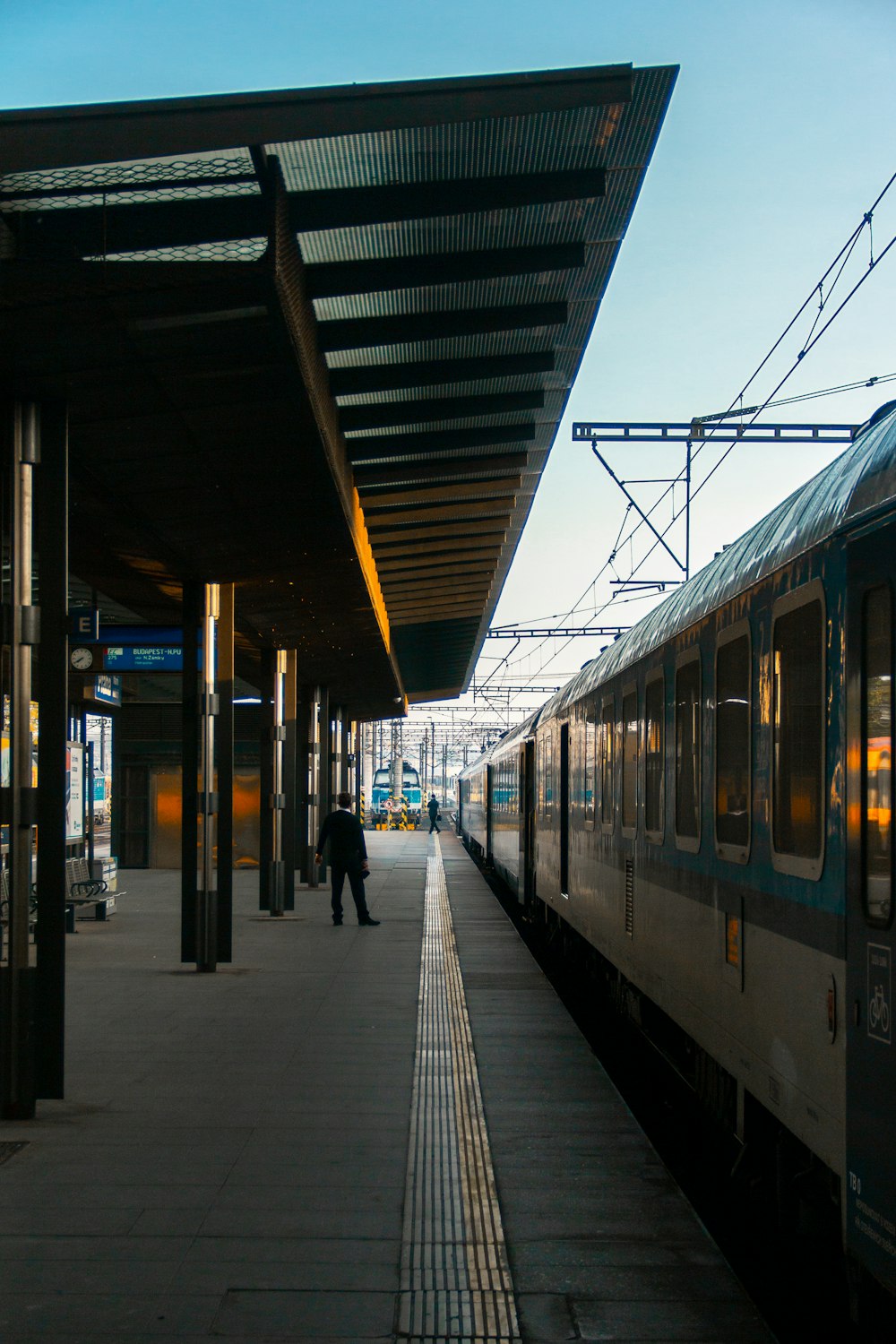 blue and yellow train in train station