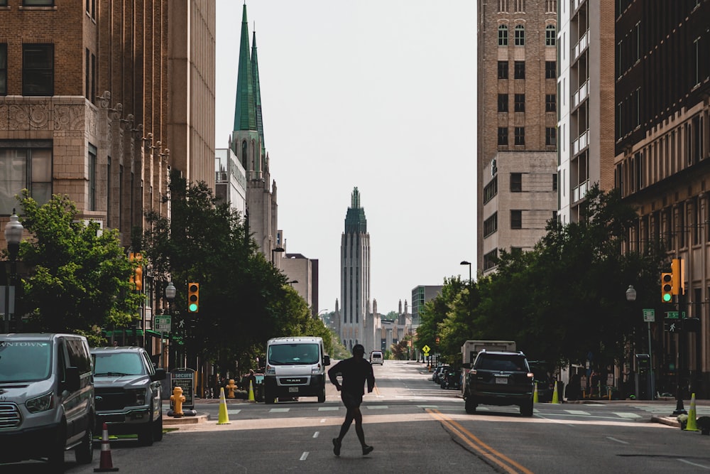 people walking on pedestrian lane near high rise buildings during daytime