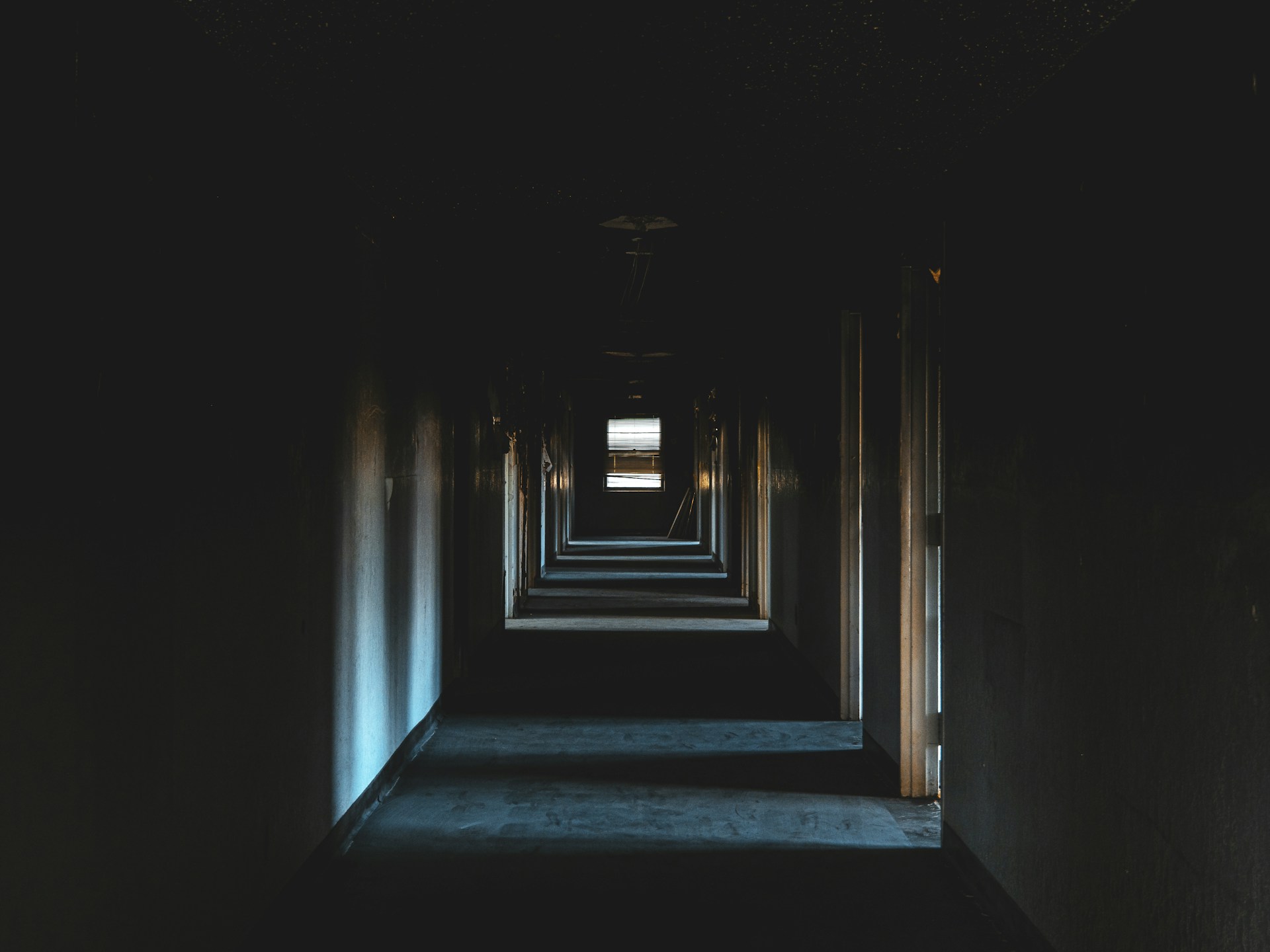 blue and white hallway with light