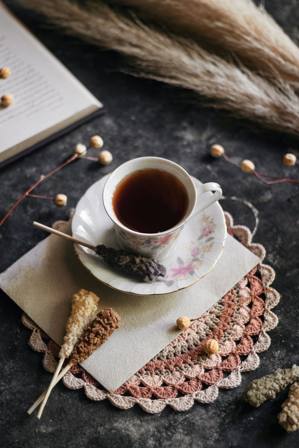 white ceramic cup on white ceramic saucer