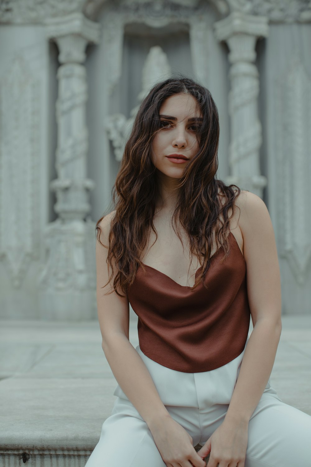 woman in red spaghetti strap dress