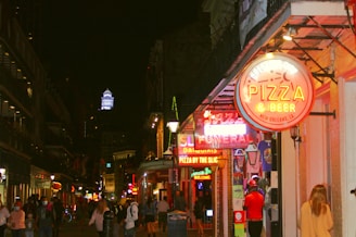 people walking on street during night time