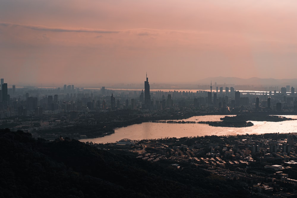 city skyline under white clouds during daytime