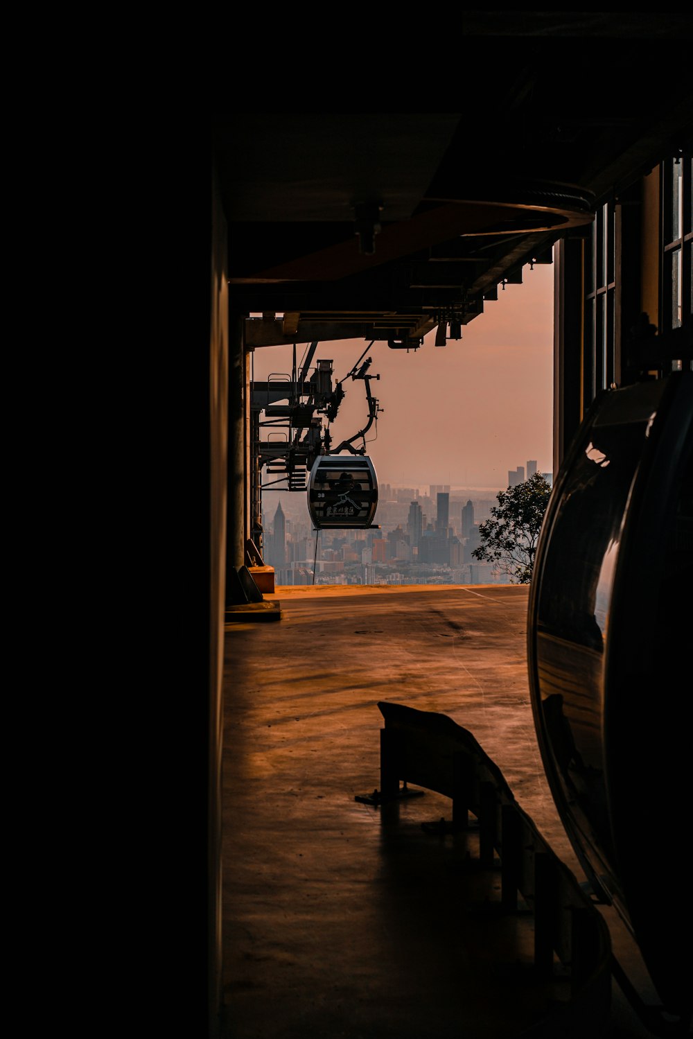 black wooden table and chairs near black car during daytime