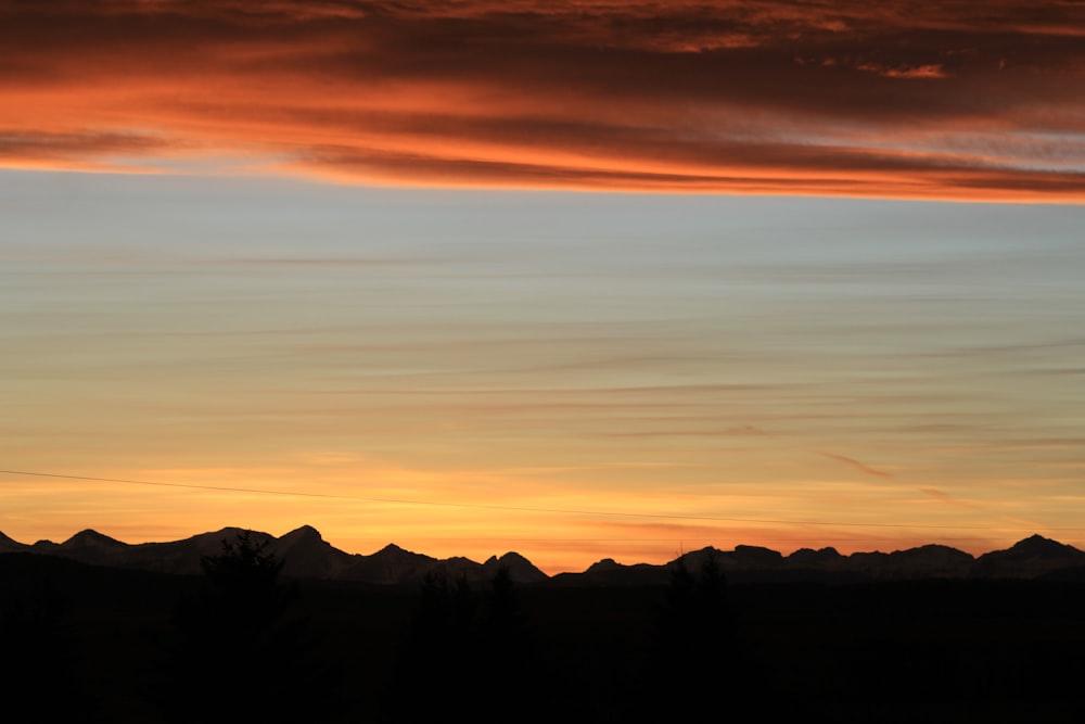 silhouette of mountains during sunset