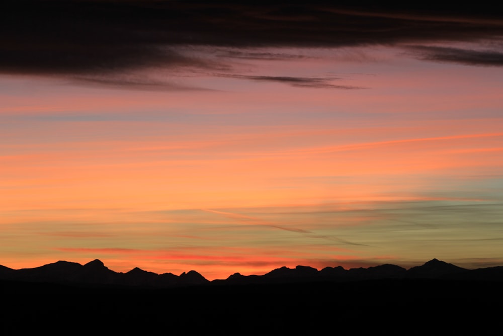 silhouette of mountains during sunset