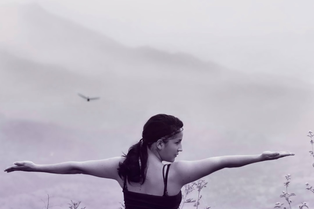 grayscale photo of woman in black spaghetti strap top