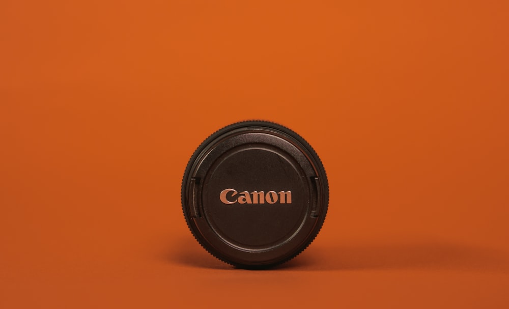 black nikon camera lens cover