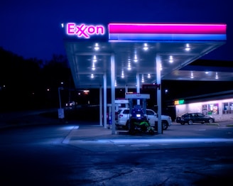 cars parked in front of UNKs store during night time