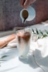 clear drinking glass with brown liquid