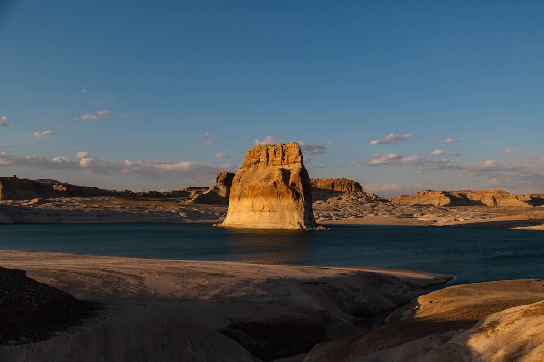 brown rock formation on sea shore during daytime