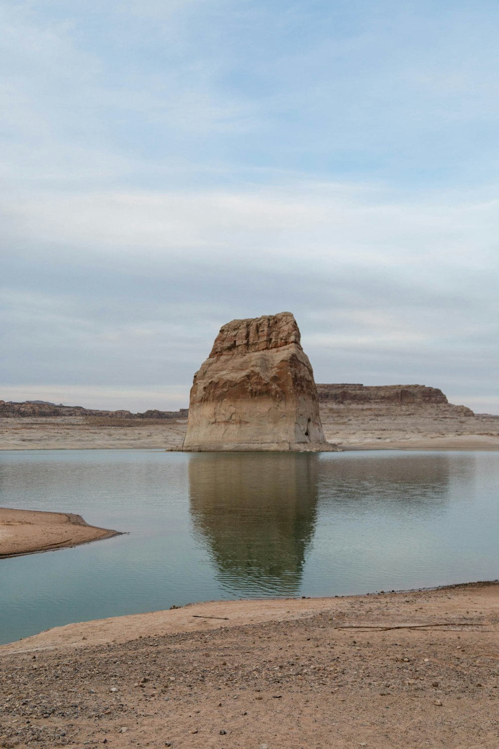 brown rock formation on sea shore during daytime