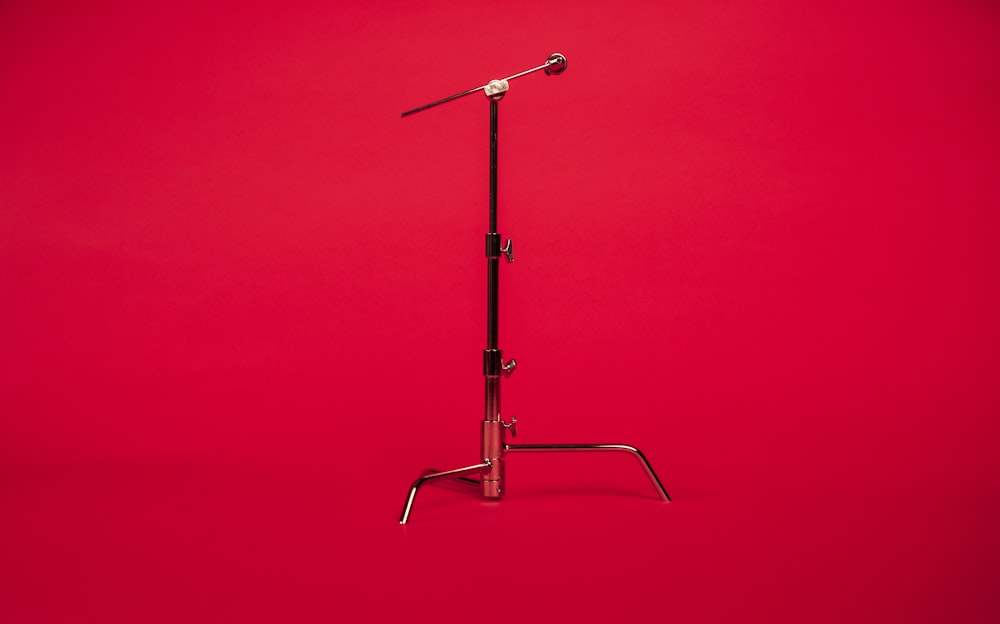 stainless steel stand with red background