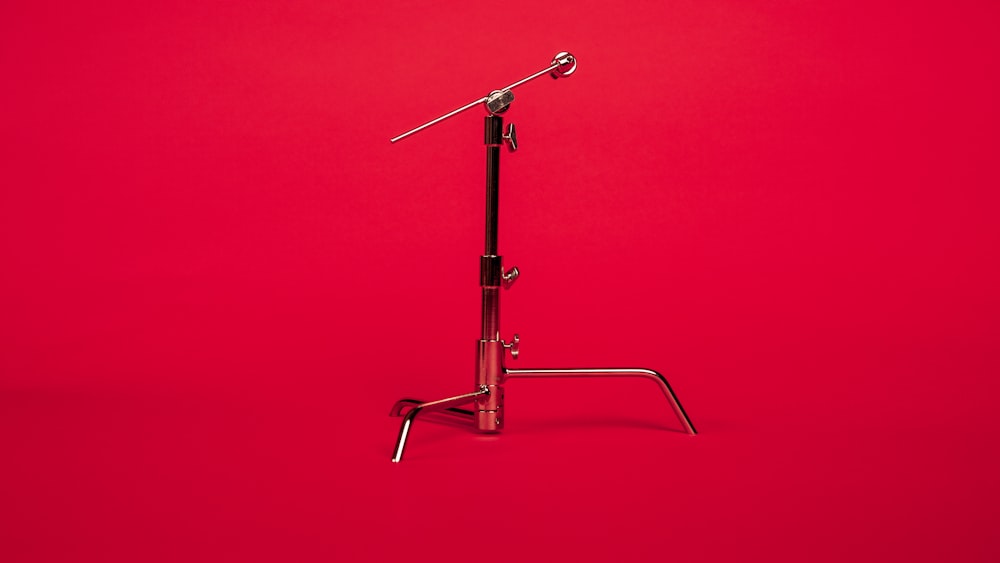 stainless steel microphone stand with red background