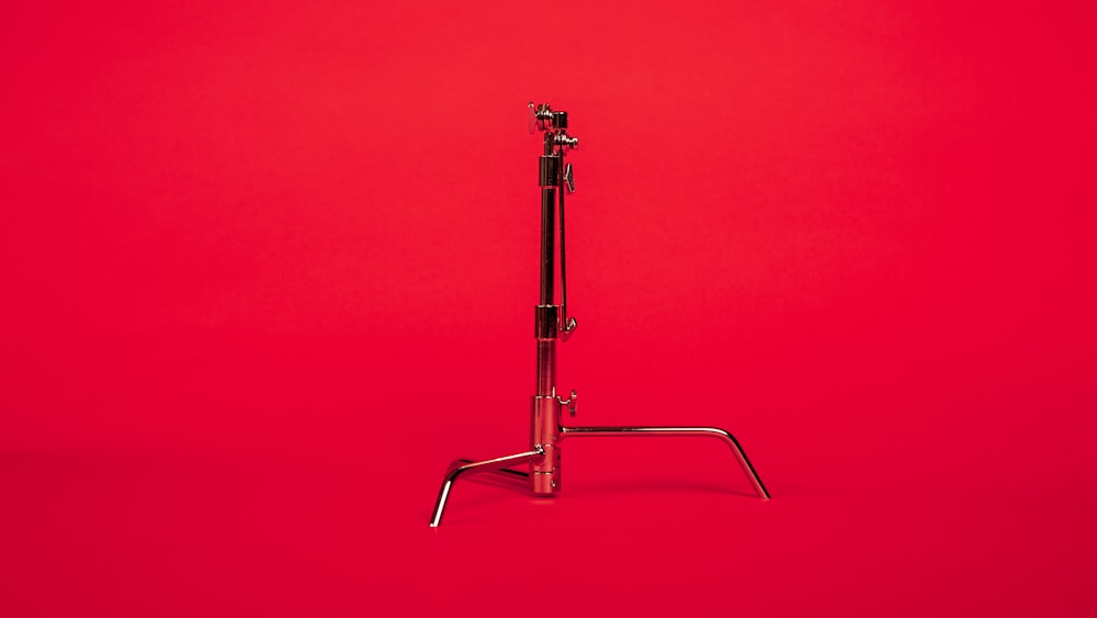 stainless steel stand with red background