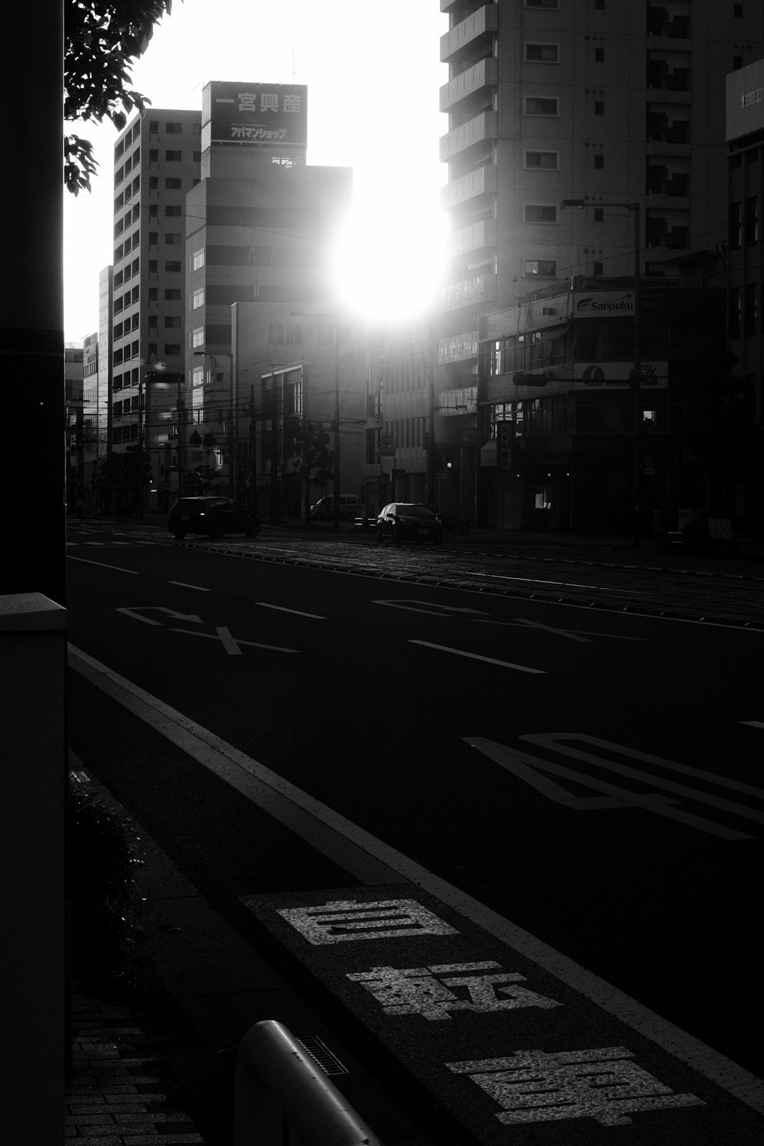 grayscale photo of city buildings during night time