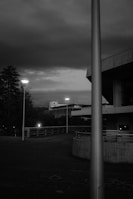 An atmospheric black-and-white photo capturing a quiet urban moment.