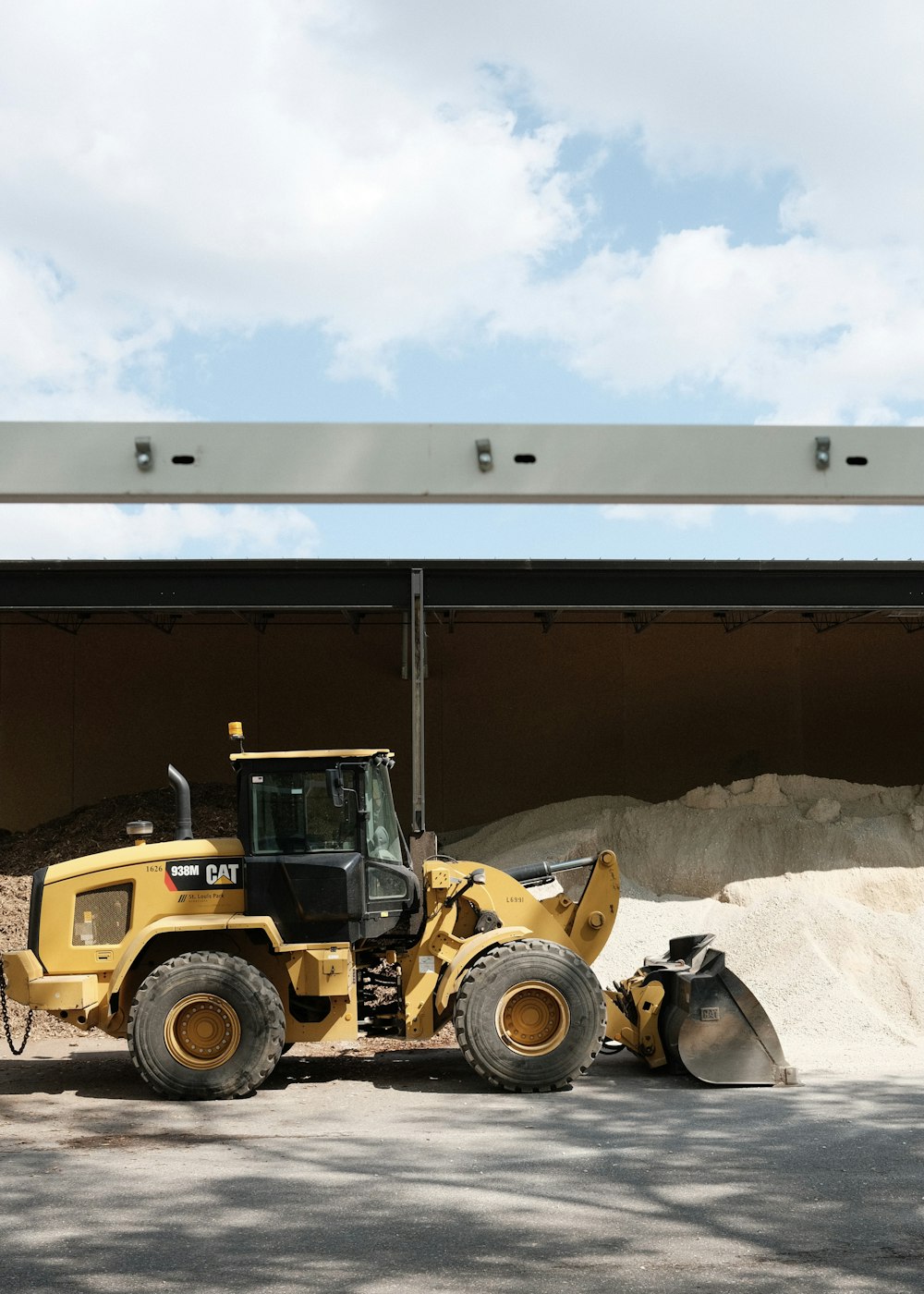 yellow and black tractor in garage