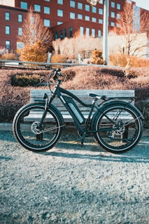 black and gray bicycle on gray concrete road during daytime