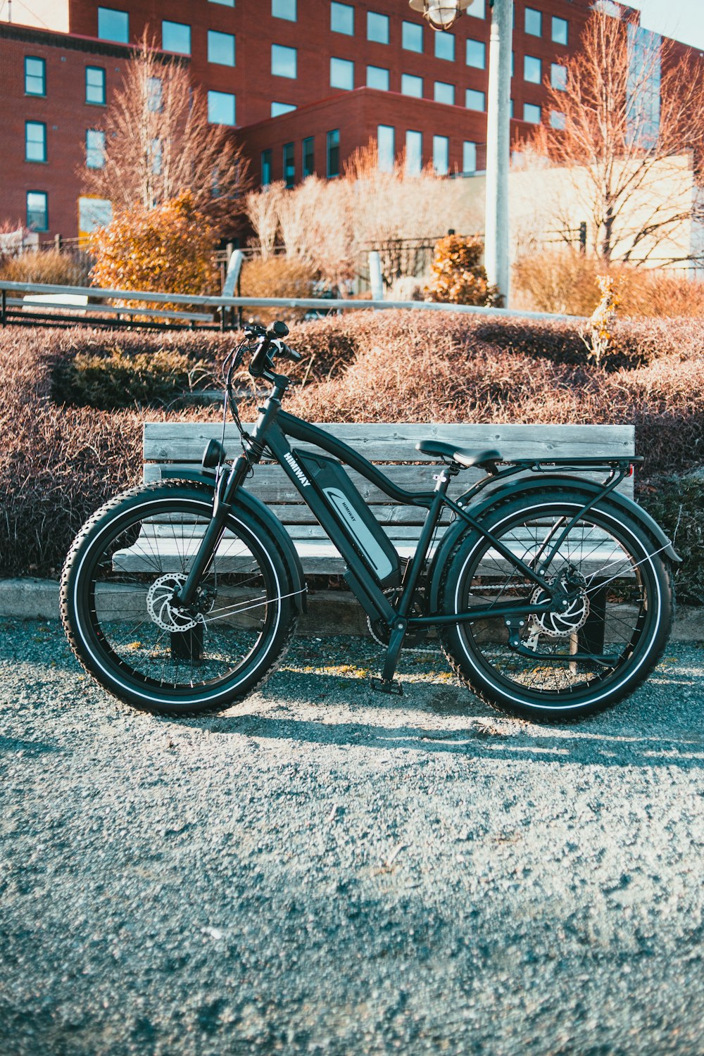 black and gray bicycle on gray concrete road during daytime