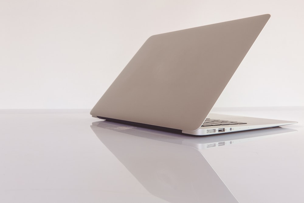 macbook air on white table