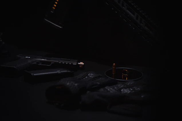 A sleek, tactical workspace with dark green accents and firearms neatly displayed under soft lighting.