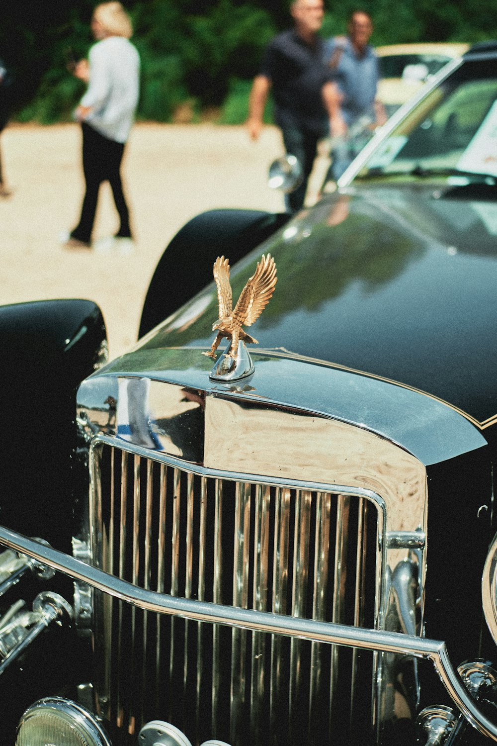 black vintage car on gray asphalt road during daytime