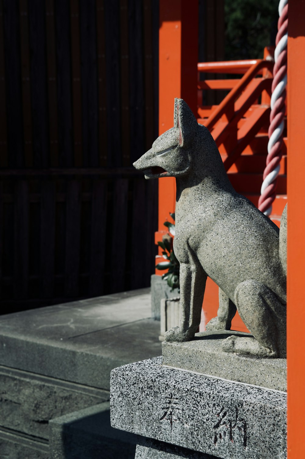 gray concrete statue on gray concrete floor