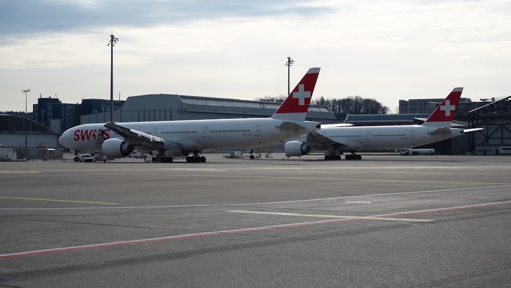 white passenger plane on airport during daytime