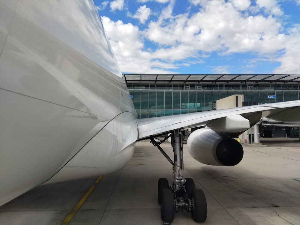 white airplane under blue sky during daytime