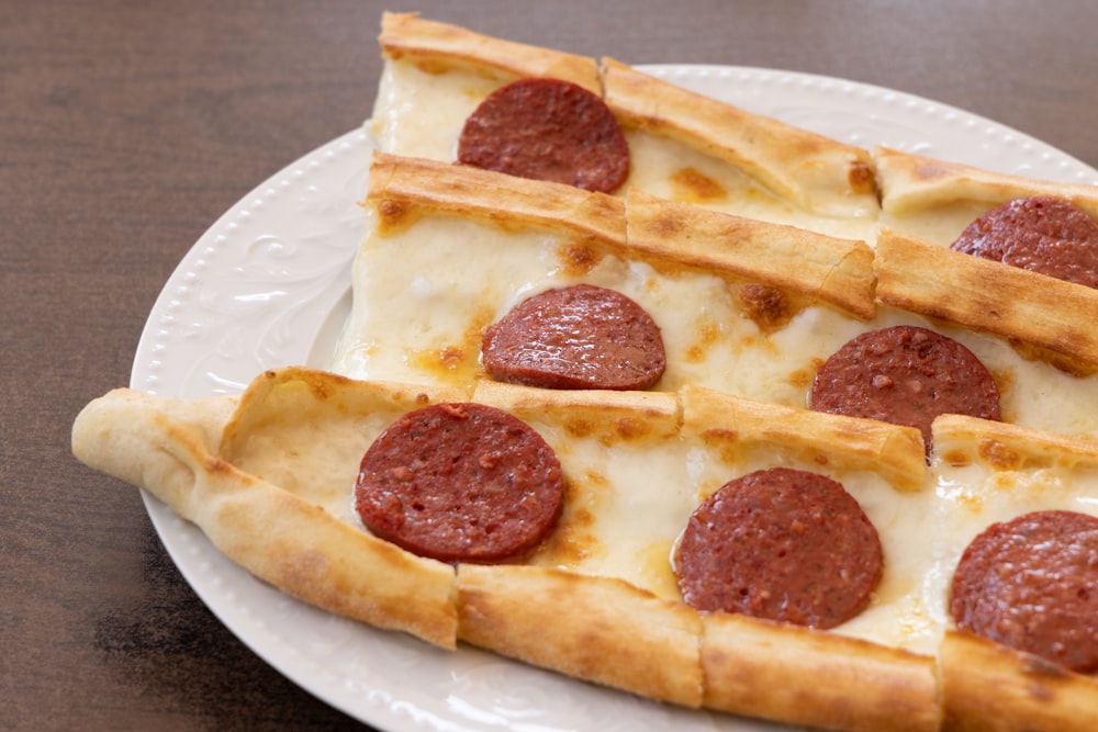 pizza on white ceramic plate