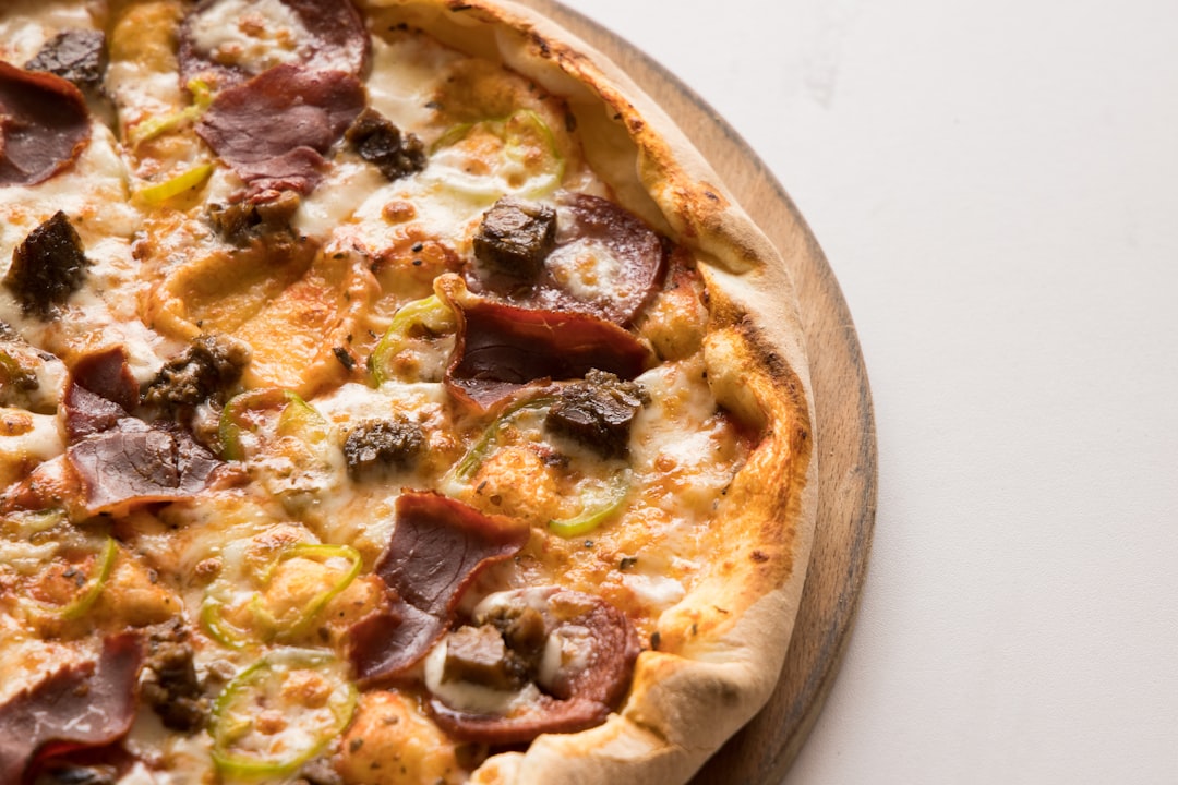 pizza on brown wooden tray