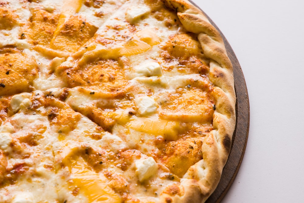 pizza on brown wooden tray