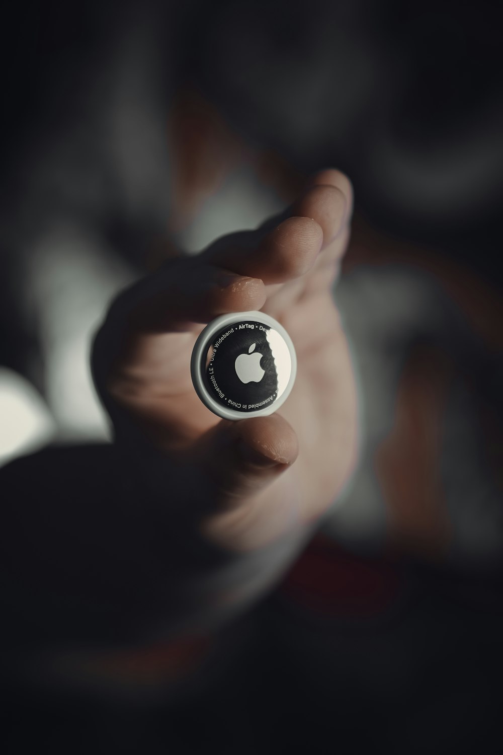 person holding black and white round ornament