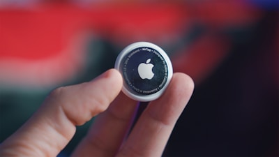 person holding black and white round plastic